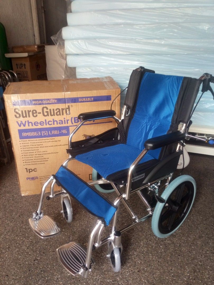 Sure-Guard Wheelchair AMB863 Blue (Category: Wheelchairs) located in Manila. Submitted by baborjener94547 (Listing ID 1469585689, Image 1). Description: Sure-Guard wheelchair in blue, model AMB863 (5) LABJ-46. Aluminum construction frame, lightweight design. 46cm seat width with soft cushion. Fixed armrest with soft sponge top, flip up legrest, foldable backrest. 6 inch PVC castor and 16 inch mag wheel with PU tyres. United handle brake, double c