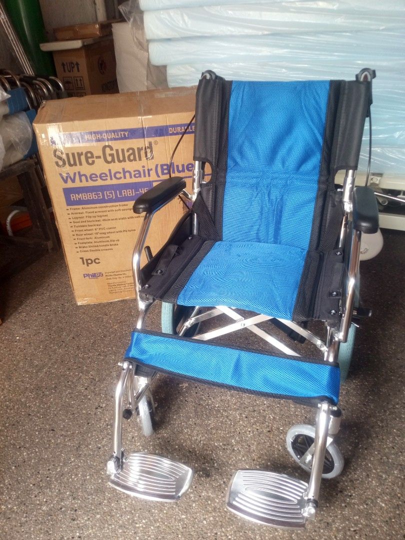 Sure-Guard Wheelchair AMB863 Blue (Category: Wheelchairs) located in Manila. Submitted by baborjener94547 (Listing ID 1469585689, Image 2). Description: Sure-Guard wheelchair in blue, model AMB863 (5) LABJ-46. Aluminum construction frame, lightweight design. 46cm seat width with soft cushion. Fixed armrest with soft sponge top, flip up legrest, foldable backrest. 6 inch PVC castor and 16 inch mag wheel with PU tyres. United handle brake, double c
