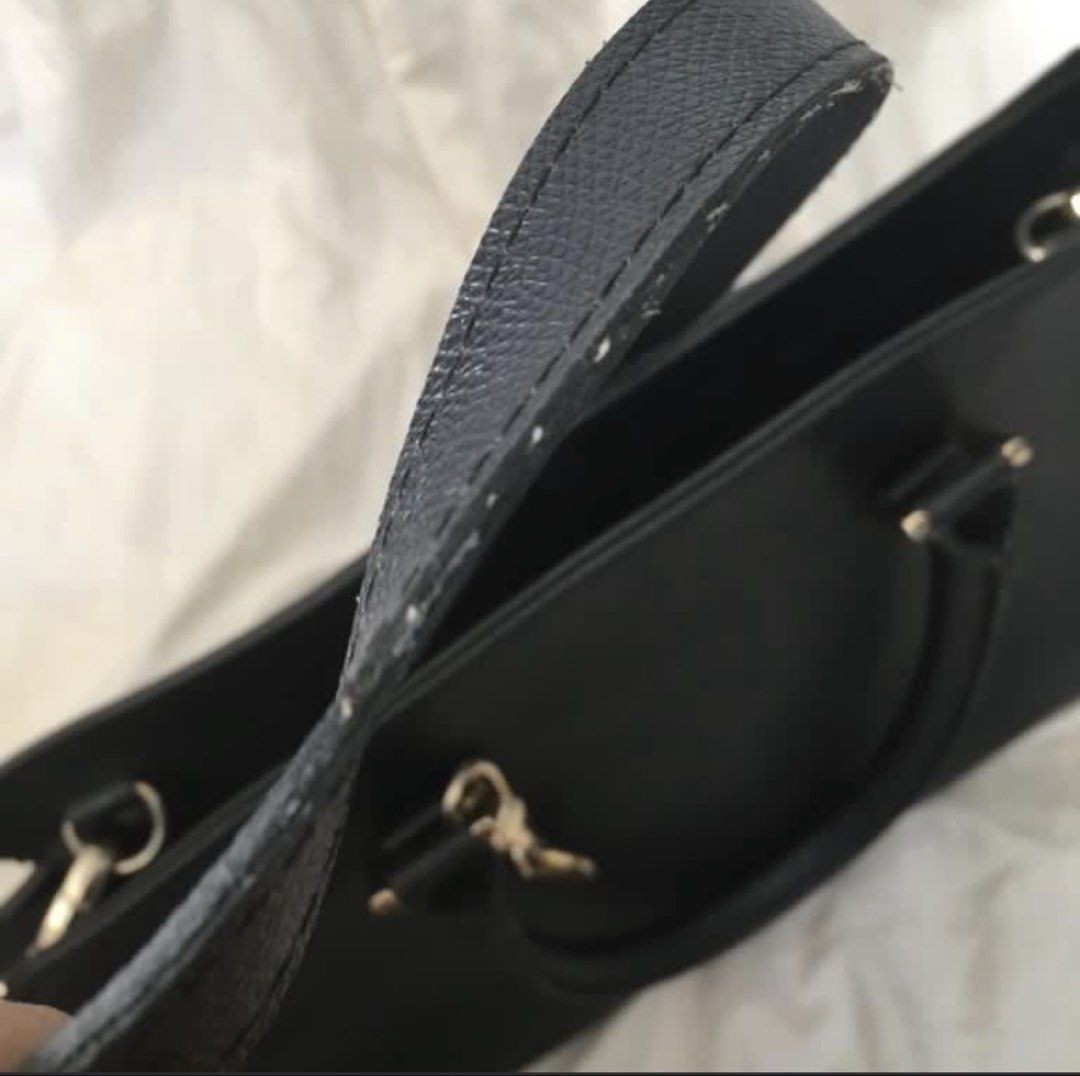 Suze La Rousse Black Handbag with Strap (Category: Shoulder Bags) located in Paranaque City. Submitted by craftywoobieph (Listing ID 1469662731, Image 2). Description: - Brand: Suze La Rousse - Color: Black with chic gold-tone hardware - Features: Structured design, top handles, and an adjustable shoulder strap - Details: Includes a stylish branded logo charm - Interior: Black fabric lining with one zippered pocket - Condition: Good, with some mi