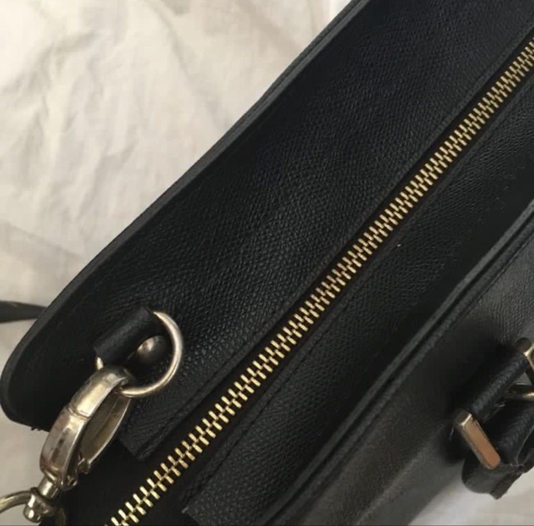 Suze La Rousse Black Handbag with Strap (Category: Shoulder Bags) located in Paranaque City. Submitted by craftywoobieph (Listing ID 1469662731, Image 3). Description: - Brand: Suze La Rousse - Color: Black with chic gold-tone hardware - Features: Structured design, top handles, and an adjustable shoulder strap - Details: Includes a stylish branded logo charm - Interior: Black fabric lining with one zippered pocket - Condition: Good, with some mi