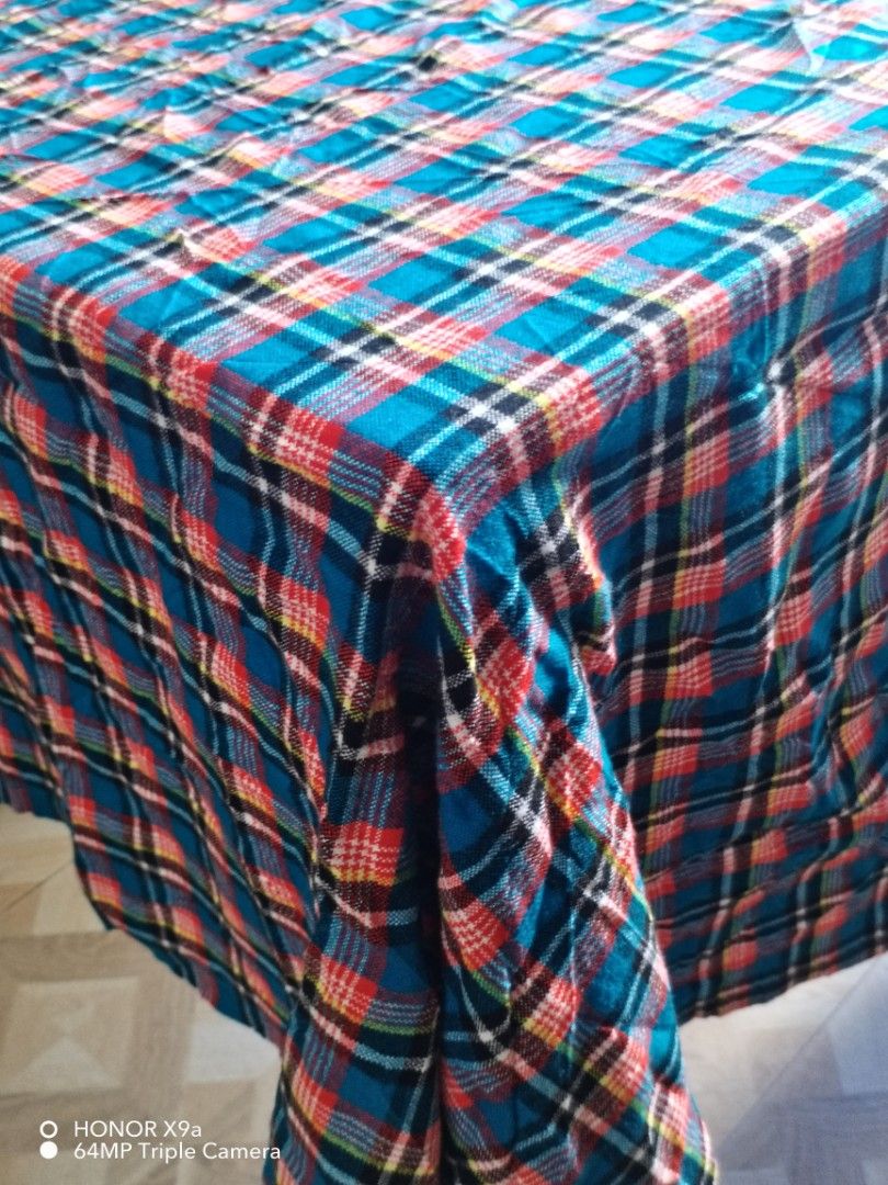 Table cloth ( 6 seaters) (Category: Table Linen & Textiles) located in Muntinlupa City. Submitted by arciagamaryann68 (Listing ID 1469590282, Image 2). Description: - Brand: Butterfly Shukas Masai - Size: 150cm x 200cm (fits 6-seater tables) - Design: Classic blue tartan/plaid pattern with red, black, and white details - Material: Superior acrylic fabric - Perfect for dining tables, home use, or gatherings.