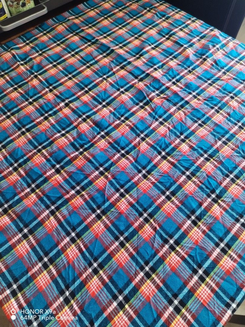 Table cloth ( 6 seaters) (Category: Table Linen & Textiles) located in Muntinlupa City. Submitted by arciagamaryann68 (Listing ID 1469590282, Image 3). Description: - Brand: Butterfly Shukas Masai - Size: 150cm x 200cm (fits 6-seater tables) - Design: Classic blue tartan/plaid pattern with red, black, and white details - Material: Superior acrylic fabric - Perfect for dining tables, home use, or gatherings.