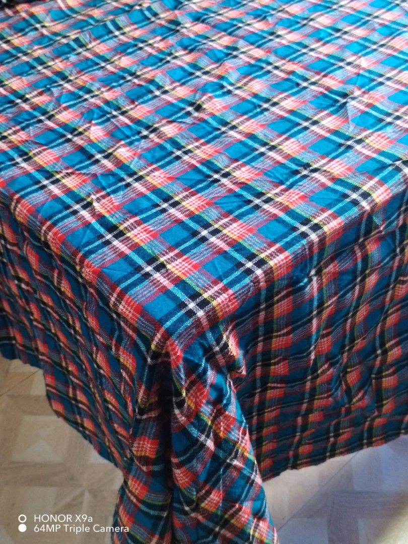 Table cloth ( 6 seaters) (Category: Table Linen & Textiles) located in Muntinlupa City. Submitted by arciagamaryann68 (Listing ID 1469590282, Image 1). Description: - Brand: Butterfly Shukas Masai - Size: 150cm x 200cm (fits 6-seater tables) - Design: Classic blue tartan/plaid pattern with red, black, and white details - Material: Superior acrylic fabric - Perfect for dining tables, home use, or gatherings.
