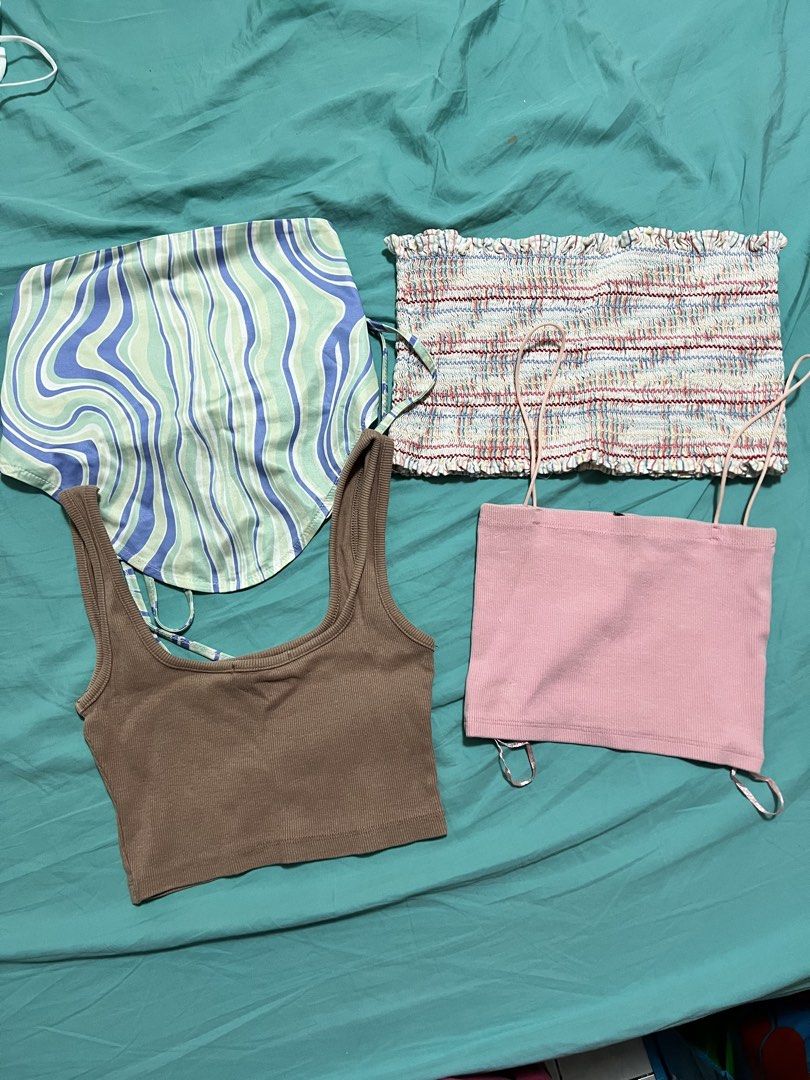 TAKE ALL Bundle crop tops and tube tops (Category: Sleeveless) located in Quezon City. Submitted by prelovedbykhy (Listing ID 1469747659, Image 1). Description: - Mixed Branded Tops - Set includes: blue/green wavy halter top, multi-colored smocked tube top, brown ribbed scoop neck tank, and pink spaghetti strap crop top - Perfect mix of styles for casual summer outfits - Selling all pieces together as a bundle.
