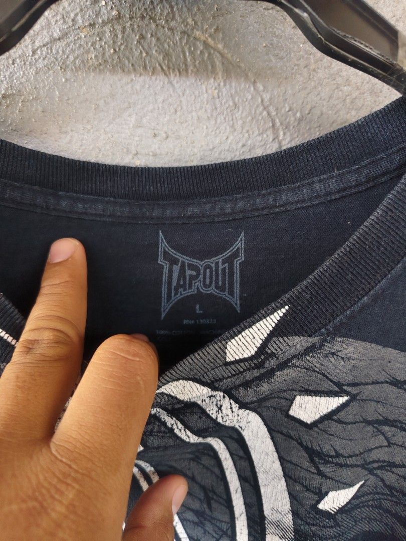 tapout shirt (Category: Activewear) located in Amadeo. Submitted by josephotep (Listing ID 1469638296, Image 3). Description: tapout shirt L on tag 21.5x28.5 perfect fade 9/10 colorate condition 650 plus sf loc cavite pm📥.