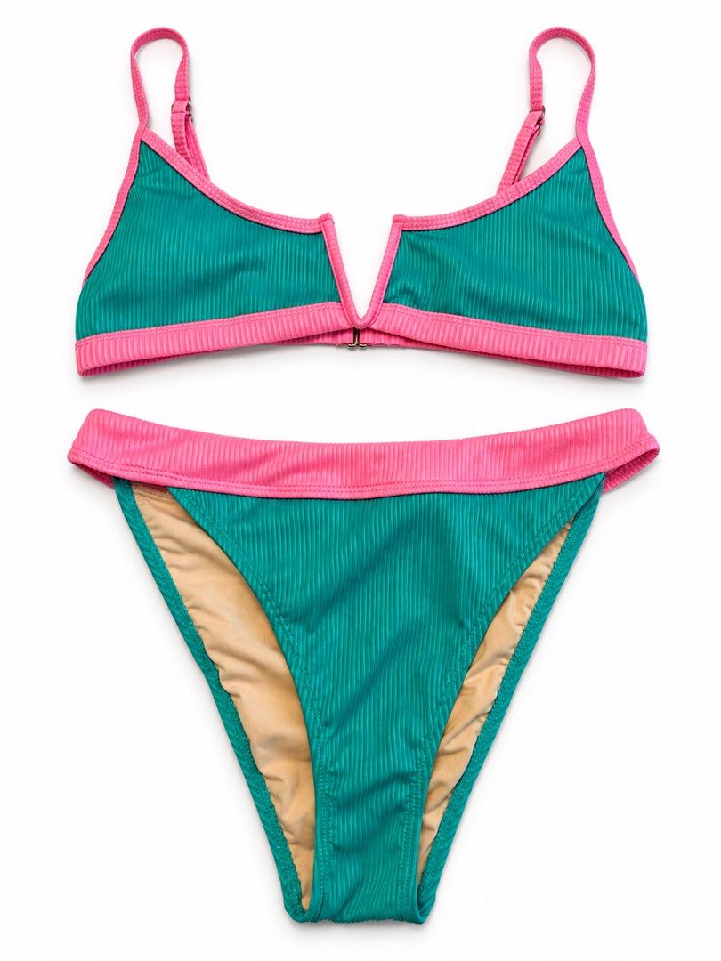 Teal and Pink Ribbed Bikini Set (Category: Bikinis & Swimsuits) located in Manila. Submitted by bellejnc (Listing ID 1469651500, Image 1). Description: - Used Once - Style: Teal and pink ribbed two-piece swimsuit - Condition: Clean fabric, no signs of wear - Top Details: Adjustable straps with a secure front clasp closure - Bottom Details: High-contrast pink waistband - Lining: Fully nude-lined on both pieces for comfort.