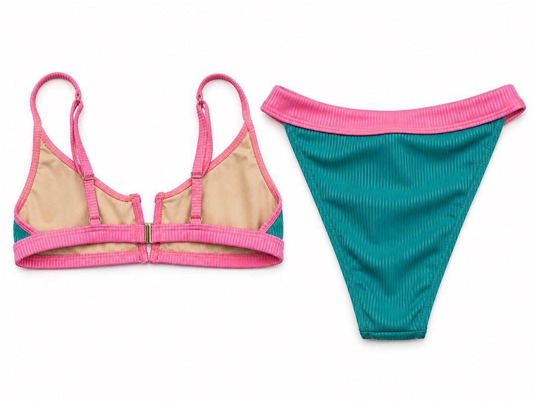 Teal and Pink Ribbed Bikini Set (Category: Bikinis & Swimsuits) located in Manila. Submitted by bellejnc (Listing ID 1469651500, Image 2). Description: - Used Once - Style: Teal and pink ribbed two-piece swimsuit - Condition: Clean fabric, no signs of wear - Top Details: Adjustable straps with a secure front clasp closure - Bottom Details: High-contrast pink waistband - Lining: Fully nude-lined on both pieces for comfort.