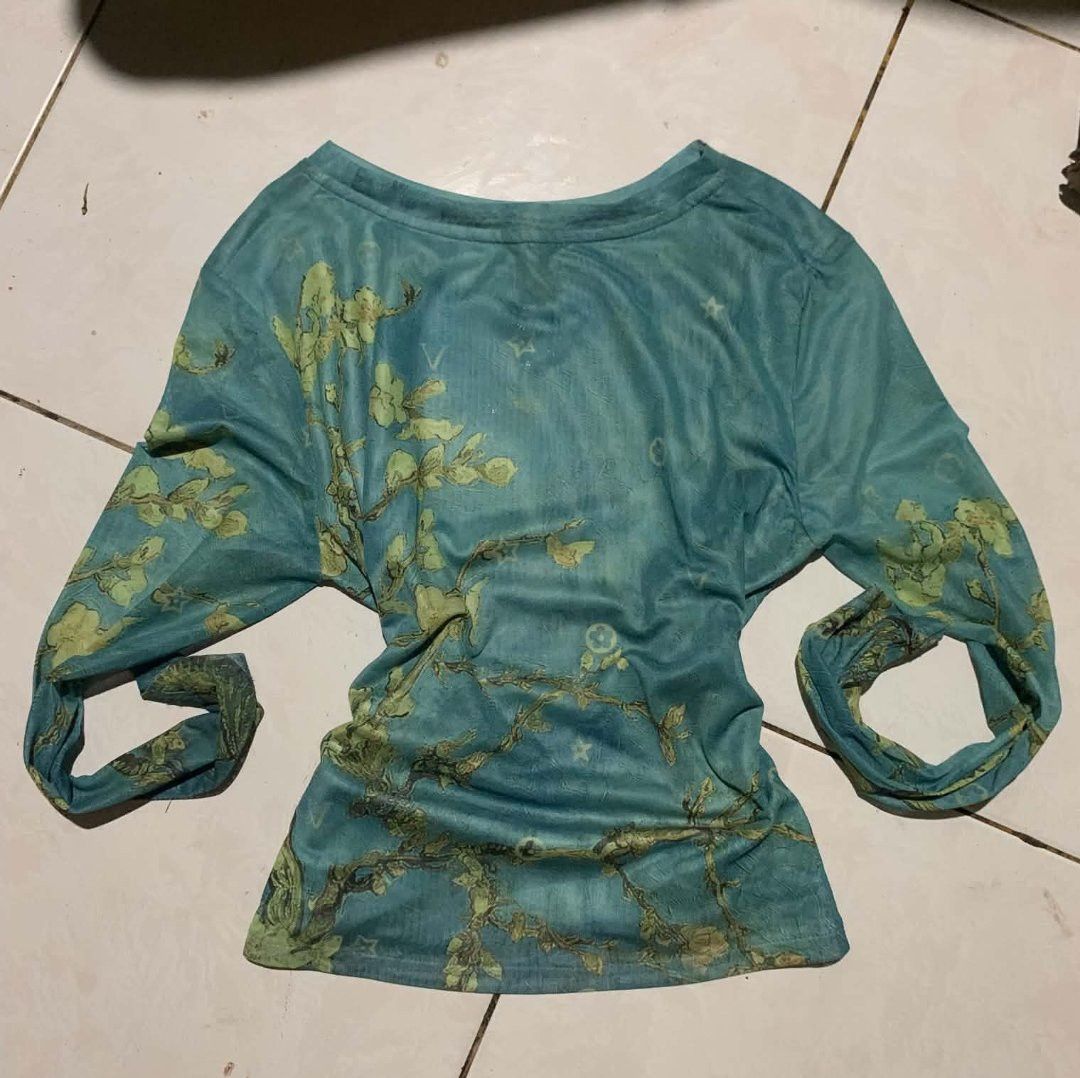 Teal Long Sleeve Top with Botanical Tree Print (Category: Longsleeves) located in Manila. Submitted by atashaaaaa (Listing ID 1469692901, Image 1). Description: - Color: Teal green with botanical tree branch print and subtle monogram background - Fit: Loose, comfortable draped fit with a flattering scoop neckline - Sleeves: Long sleeves - Fabric: Soft and stretchy for all-day comfort - Style: Versatile casual piece perfect for everyday wear.