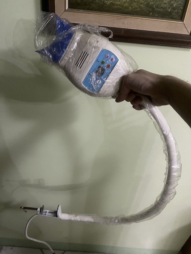Teeth Whitening Light Machine with Desk Clamp (Category: Medical Supplies & Tools) located in Manila. Submitted by pasaybestfinds (Listing ID 1469676442, Image 1). Description: Teeth whitening machine with flexible gooseneck arm and control panel. Still wrapped in protective plastic. Includes mounting clamp for desks or tables and power cord. Plug it in, set the timer, and use for dental procedures at home or in the clinic..