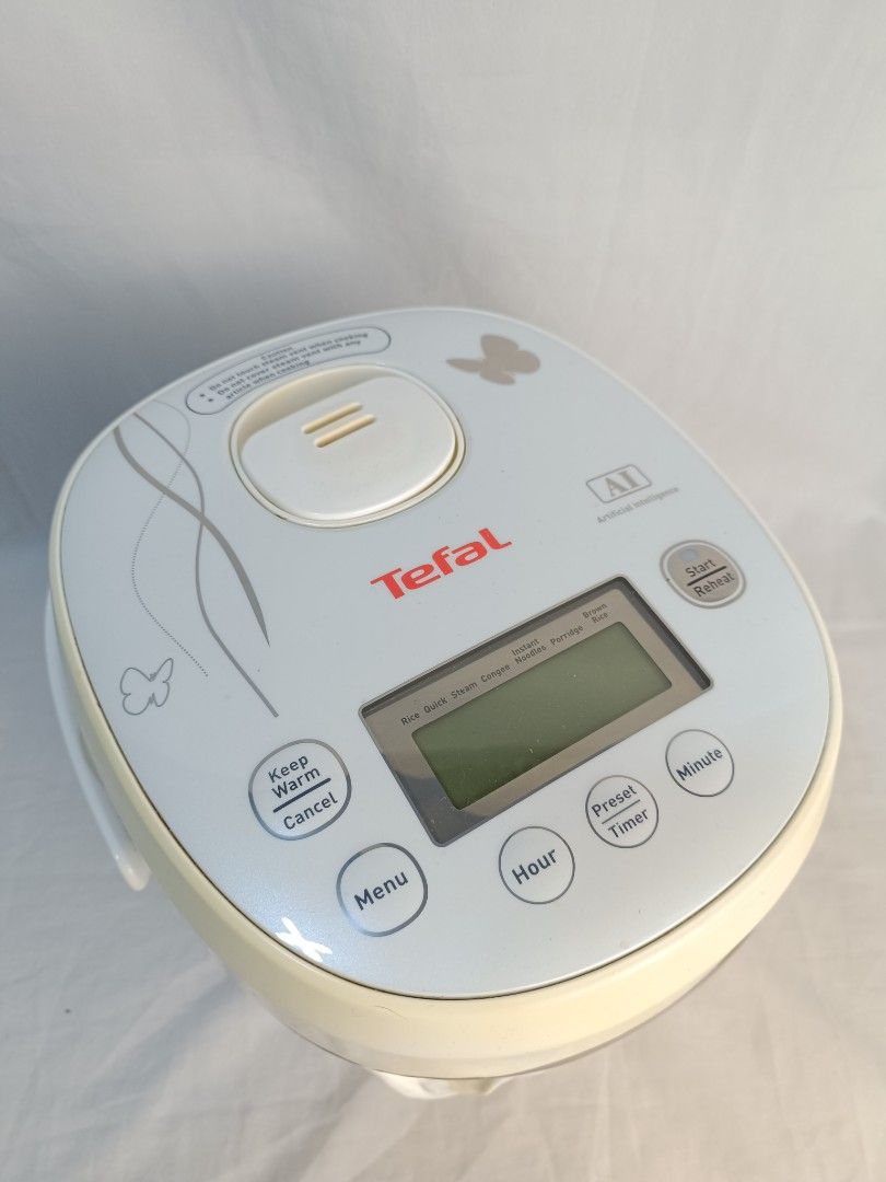 Tefal AI Digital Rice Cooker (Category: Cookers) located in Baguio. Submitted by clothes.over.bros.ph_2020 (Listing ID 1469596227, Image 2). Description: - Brand: Tefal AI Rice Cooker - Display: Digital panel on top with preset timer, keep warm, and menu functions - Capacity: Brown inner pot with measurements up to 4 cups / 3/4 liter - Condition: Clean interior heating element, well-maintained - Inclusions: Power cord (still wrapped in plastic) -