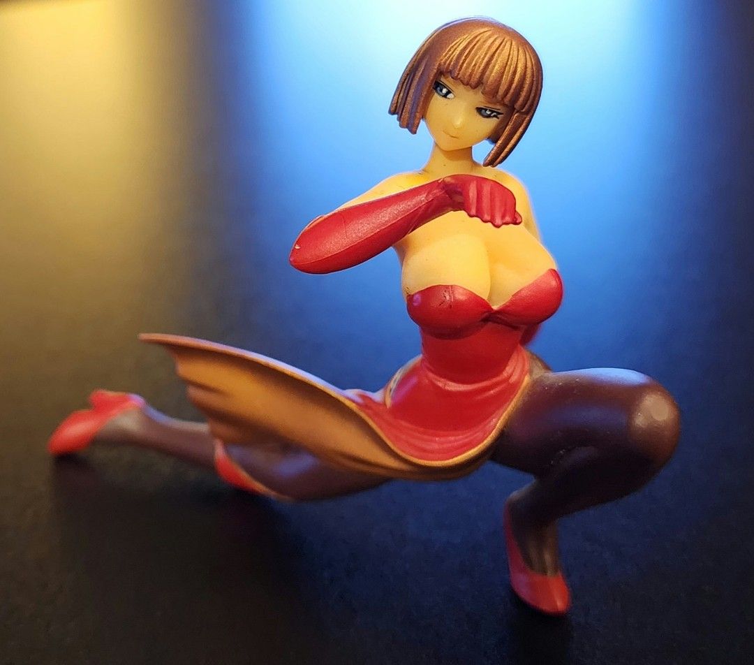 Tekken Anna Williams (Category: Figurines & Statues) located in Arayat. Submitted by collectorboy143 (Listing ID 1469581754, Image 3). Description: - Collectible anime female figure in a dynamic martial arts lunge pose - Outfit: Red and gold strapless top, dark tights, and red heels - Features: Brown short hair with bangs and striking blue eyes - Base: Mounted on a sturdy small black circular base - Quality: Highly detailed sculpt with vibrant re