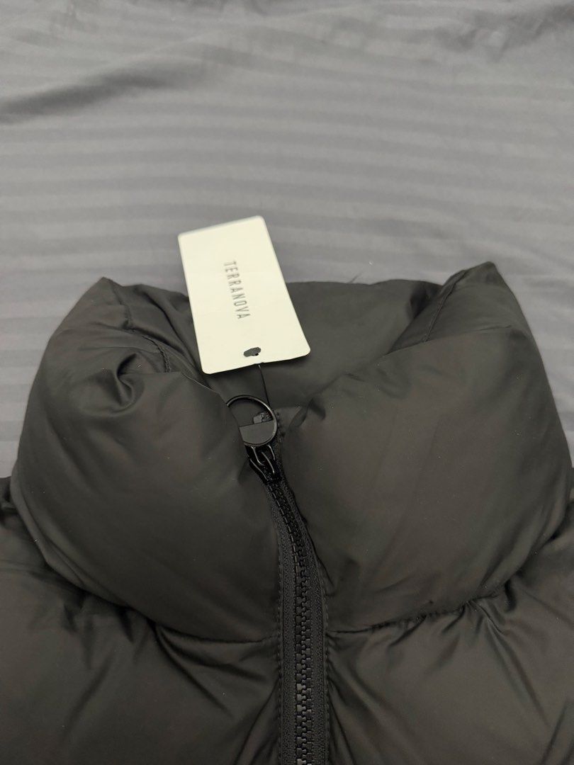 Terranova Black Puffer Vest Size S (Category: Sleeveless) located in Manila. Submitted by karminareyes123 (Listing ID 1469680407, Image 3). Description: - Brand: Terranova - Item: Black Puffer Vest - Size: Small - Condition: Brand new with original tags (BNWT), clean and unworn - Design: Quilted puffer with high collar and front zipper closure - Features: Convenient side pockets - Perfect for: Cold weather layering.