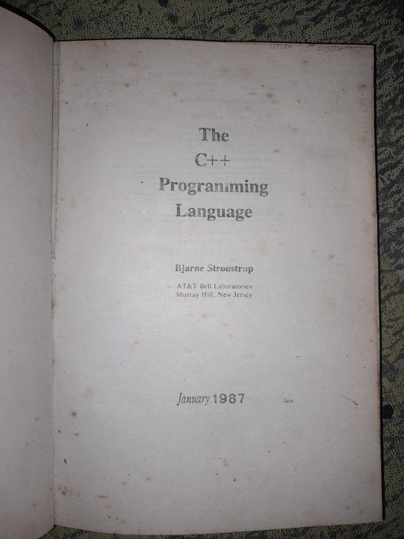 The C++ Programming Language by Bjarne Stroustrup 1987 (Category: Textbooks) located in Manila. Submitted by booksljjw (Listing ID 1469623530, Image 2). Description: - Title: The C++ Programming Language by Bjarne Stroustrup - Edition/Publisher: AT&T Bell Laboratories, January 1987 - Format: Hardcover with blue textured cover and gold lettering - Condition: Solid binding; interior pages show vintage age-related foxing and spotting - Ideal for: Co