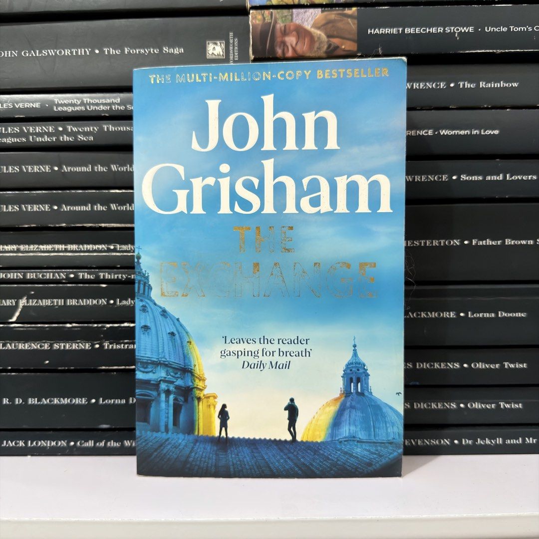 The Exchange by John Grisham (Category: Storybooks) located in Lingayen. Submitted by readwjane (Listing ID 1469591651, Image 1). Description: - Author: John Grisham - Genre: Legal thriller / Suspense - Format: Paperback - Synopsis: Follows iconic characters from The Firm years later - Condition: Clean cover design with blue tones and dome imagery - Perfect for: Weekend reading sessions.