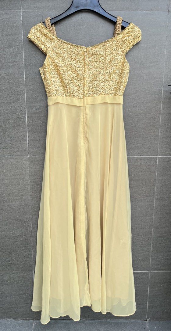 Evening gown (Category: Evening dresses & gowns) located in Cainta. Submitted by klejre (Listing ID 1469687283, Image 2). Description: Off-shoulder formal evening gown featuring a gold sequin floral-lace bodice and a flowing light-yellow or champagne chiffon skirt..