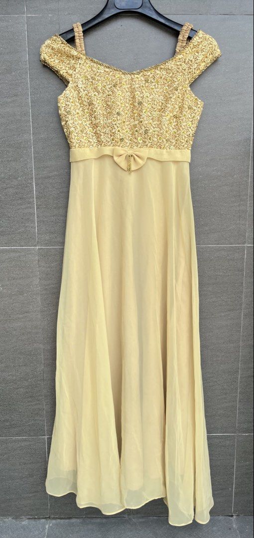 Evening gown (Category: Evening dresses & gowns) located in Cainta. Submitted by klejre (Listing ID 1469687283, Image 1). Description: Off-shoulder formal evening gown featuring a gold sequin floral-lace bodice and a flowing light-yellow or champagne chiffon skirt..