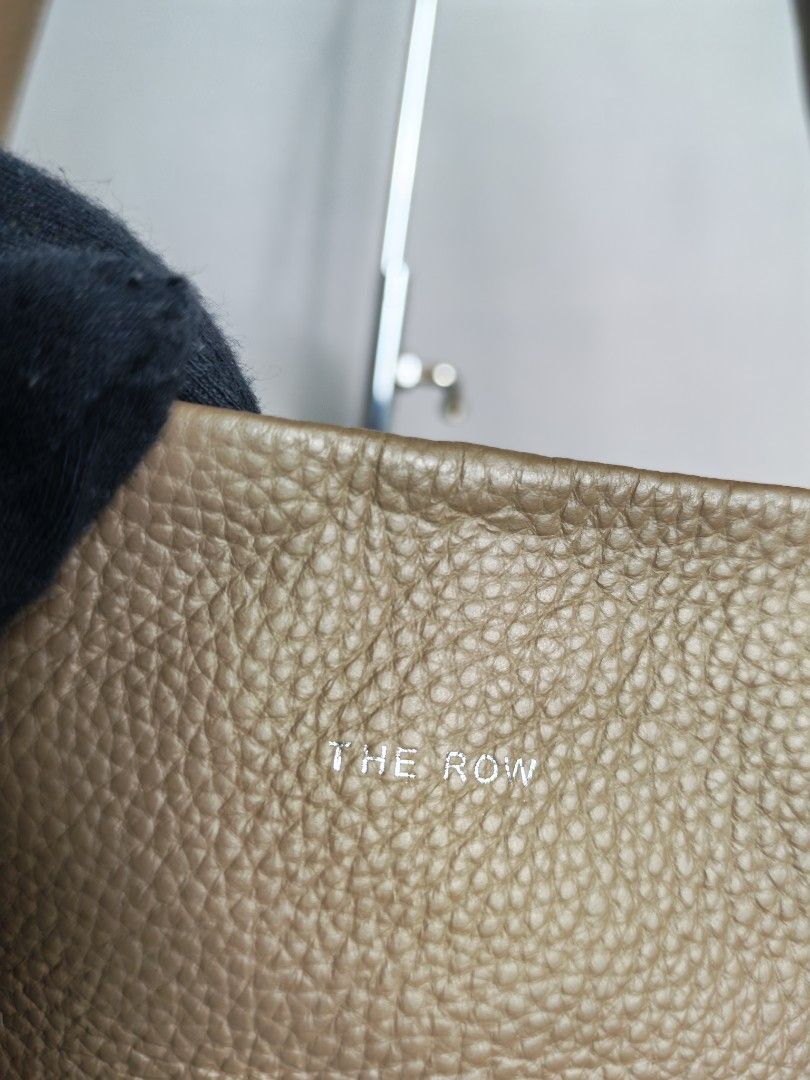 The Row Ns Park Tote Bag Medium Grained Leather (Category: Luxury Bags & Wallets) located in Baguio. Submitted by luxuryph2600_eric (Listing ID 1469594885, Image 3). Description: THE ROW Ns Park Tote Leather Bag DETAILS⬇️⬇️⬇️ 📌Rank A ( Excellent Condition) 📌Size Medium 📌Color Rate 10/10 💰💰💰PRICE: 3500 FREESHIP 🐲LOCATION : Baguio City PRICE is negotiable just Send me your OFFER Shipping via JnT BOX BAG RANKING GUIDE: RANK SA - Good as new, 