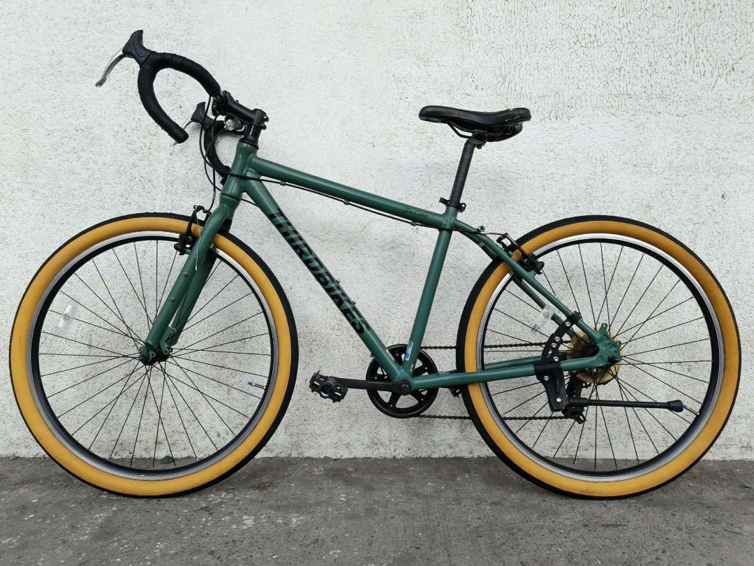 ThirdBikes Gravel/MTB 27.5 (Category: Bicycles) located in General Santos City (Dadiangas). Submitted by cclarimelvintageclassicretro (Listing ID 1469717743, Image 3). Description: - Brand: Third Bikes (City Commuter Road ,Gravel,Mtb 17" Seat Tube / 21" Top Tube ( 1 x 7 speed ) - Color: Green frame with striking yellow tires and black rims - Handlebars: Drop handlebars equipped with silver brake levers - Drivetrain: Single chainring setup up fron