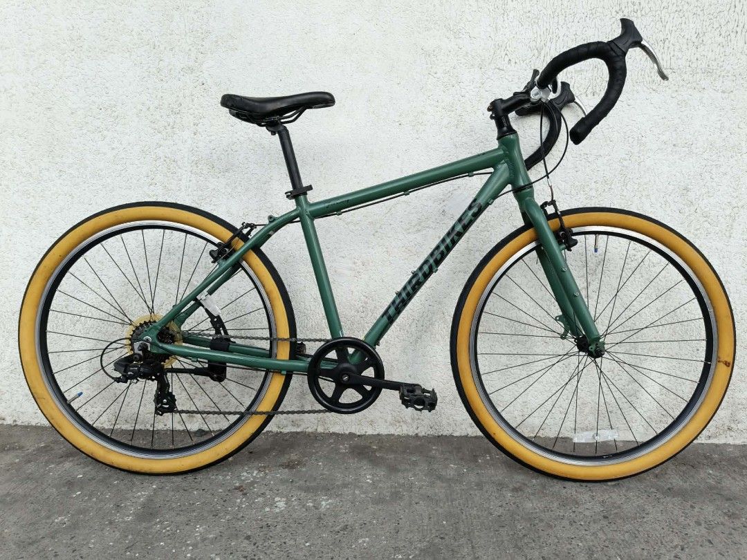 ThirdBikes Gravel/MTB 27.5 (Category: Bicycles) located in General Santos City (Dadiangas). Submitted by cclarimelvintageclassicretro (Listing ID 1469717743, Image 1). Description: - Brand: Third Bikes (City Commuter Road ,Gravel,Mtb 17" Seat Tube / 21" Top Tube ( 1 x 7 speed ) - Color: Green frame with striking yellow tires and black rims - Handlebars: Drop handlebars equipped with silver brake levers - Drivetrain: Single chainring setup up fron