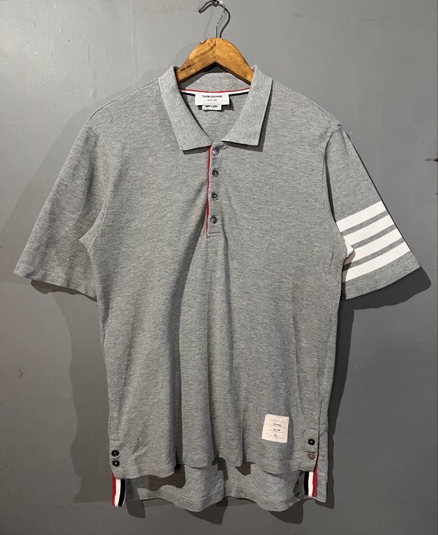 Thom Browne 4 bar Polo Shirt (Category: Luxury Apparel) located in San Mateo. Submitted by street_rev (Listing ID 1469689135, Image 1). Description: 27/29 x 21.