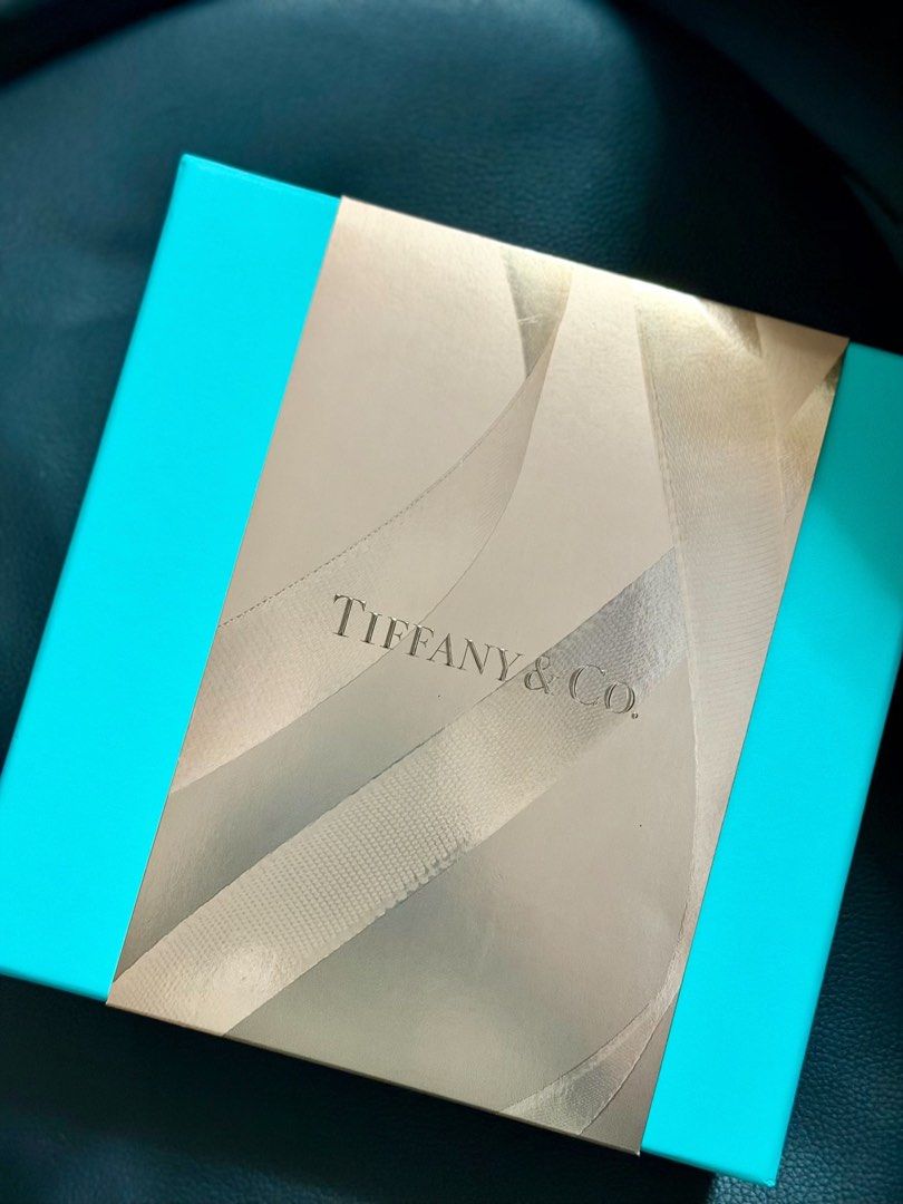 Tiffany & Co. Gift Box (Category: Fragrance & Deodorants) located in Manila. Submitted by beishop (Listing ID 1469708155, Image 2). Description: - Authentic Tiffany & Co. - Iconic robin's egg blue color with a metallic gold ribbon-graphic sleeve - Sturdy cardboard construction with clean edges - Perfect for gifting jewelry, watches, or small trinkets - Great for safely storing your precious keepsakes original price is 6k rfs: di bet yung scent di