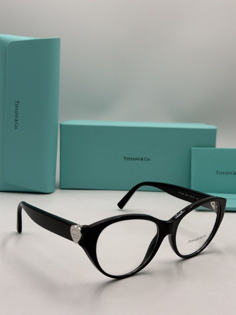 Tiffany & Co. TF2244 Eyeglasses (Color Code: 8001 / Black) (Category: Luxury Accessories) located in Lipa City. Submitted by _cmluxephilippines (Listing ID 1469579477, Image 1). Description: Tiffany & Co. TF2244 Eyeglasses (Color Code: 8001 / Black) • Brand: Tiffany & Co. • Model Number: TF2244 / TF2244F • Color Code: 8001 (Shiny Black Frame) • Frame Material: Premium Italian Acetate • Shape: Cat-Eye / Rounded Phantos • Features: Signature silver