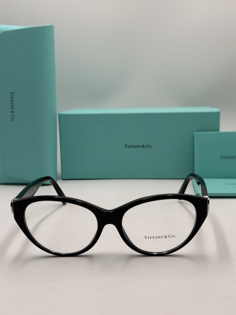 Tiffany & Co. TF2244 Eyeglasses (Color Code: 8001 / Black) (Category: Luxury Accessories) located in Lipa City. Submitted by _cmluxephilippines (Listing ID 1469579477, Image 2). Description: Tiffany & Co. TF2244 Eyeglasses (Color Code: 8001 / Black) • Brand: Tiffany & Co. • Model Number: TF2244 / TF2244F • Color Code: 8001 (Shiny Black Frame) • Frame Material: Premium Italian Acetate • Shape: Cat-Eye / Rounded Phantos • Features: Signature silver