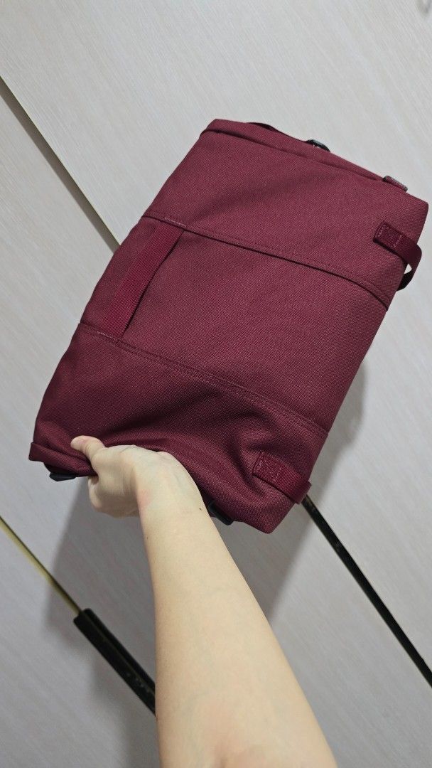 Timbuk2 Maroon Messenger Bag (Category: Sling Bags) located in Pasig City. Submitted by spaceshift (Listing ID 1469710725, Image 2). Description: - Brand: Timbuk2 - Color: Maroon / Deep Wine Red - Material: Durable canvas fabric - Closure: Front flap with secure buckle straps - Features: Visible brand label on lower right, multiple top straps and loops, clean interior space - Condition: Ready for daily commutes or casual travel.