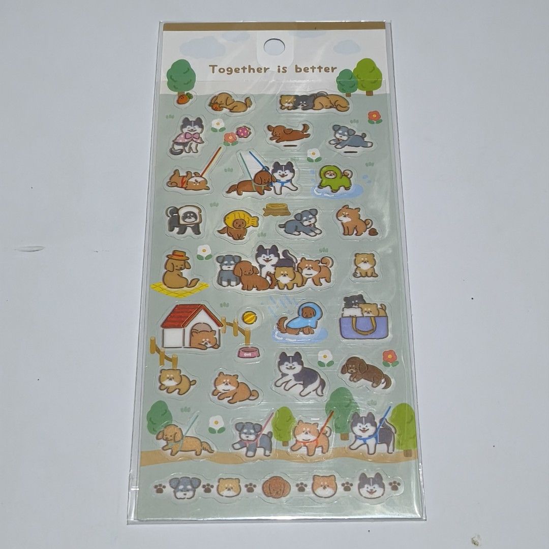 Together is better cute dog stickers sheet (Category: Art & Prints) located in Manila. Submitted by abbey.lee (Listing ID 1469655993, Image 1). Description: - Condition: Brand new, sealed in original plastic packaging - Design: Cute dogs, puppies, dog houses, trees, and "Together is better" text - Perfect for: Journaling, scrapbooking, and decorating phone cases - Ideal for dog lovers and stationery enthusiasts - PM for inquiries or fast shipping