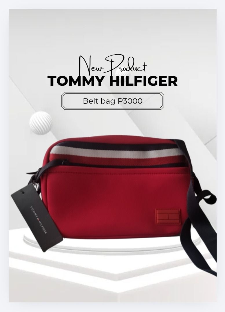 Tommy Hilfiger Belt Bag Red (Category: Cross-body Bags) located in Makati City. Submitted by sansuramos72328 (Listing ID 1469583023, Image 1). Description: Red Tommy Hilfiger belt bag with striped webbing across the front. Includes branded tag attached to the side strap. Adjustable black strap for waist or crossbody wear. Small rectangular logo patch near the bottom corner. Clean zip-top design..
