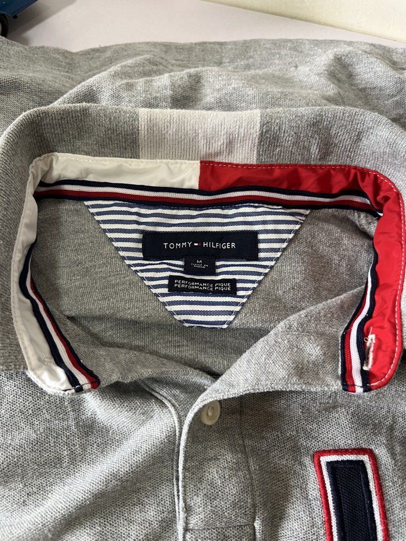 Tommy Hilfiger Polo Shirt (Category: Tshirts & Polo Shirts ) located in Calamba. Submitted by emjaythrift (Listing ID 1469647788, Image 3). Description: TOMMY HILFIGER POLO ° Size: Medium ° Width: 20 ° Length: Front-26 / Back-27.5 ° Color Rate: 9.5/10 ° Issue: ❌ ° Excellent Condition ° See comm for other pictures.