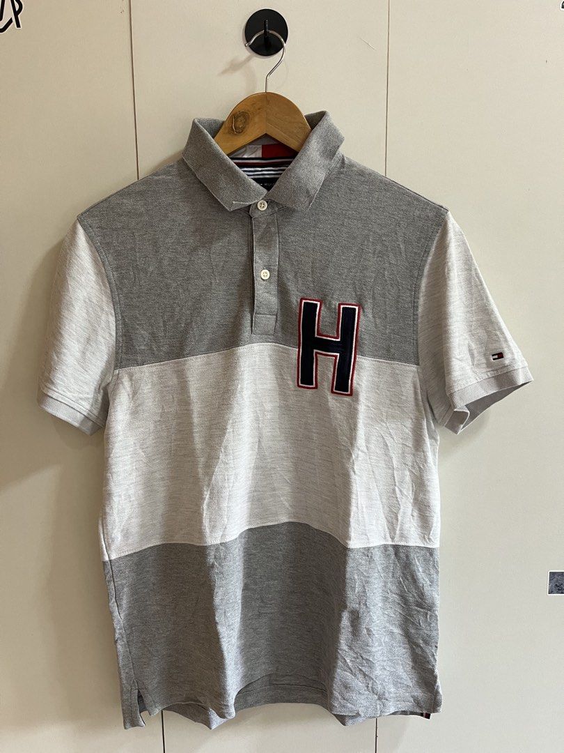 Tommy Hilfiger Polo Shirt (Category: Tshirts & Polo Shirts ) located in Calamba. Submitted by emjaythrift (Listing ID 1469647788, Image 1). Description: TOMMY HILFIGER POLO ° Size: Medium ° Width: 20 ° Length: Front-26 / Back-27.5 ° Color Rate: 9.5/10 ° Issue: ❌ ° Excellent Condition ° See comm for other pictures.