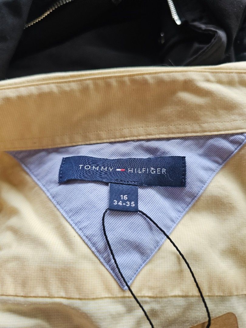 Tommy Hilfiger yellow polo (Category: Formal Shirts) located in Baguio. Submitted by kayeonlineshop (Listing ID 1469662612, Image 3). Description: pale yellow, long-sleeve button-down dress shirt with a spread collar and barrel cuffs..
