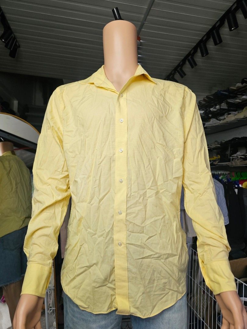 Tommy Hilfiger yellow polo (Category: Formal Shirts) located in Baguio. Submitted by kayeonlineshop (Listing ID 1469662612, Image 2). Description: pale yellow, long-sleeve button-down dress shirt with a spread collar and barrel cuffs..