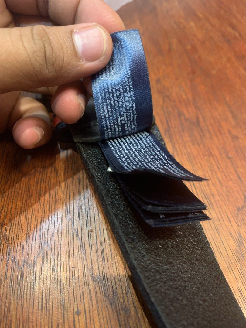 Tommy Jeans Black Leather Belt Size 90 (Category: Belts) located in Cagayan de Oro. Submitted by agboysalis60090 (Listing ID 1469709242, Image 3). Description: Black leather belt by Tommy Jeans. Metal buckle stamped with branding. Red and white loop detail near the buckle. Size 90. Multiple care tags attached near the end. Sturdy leather strap with clear texture..