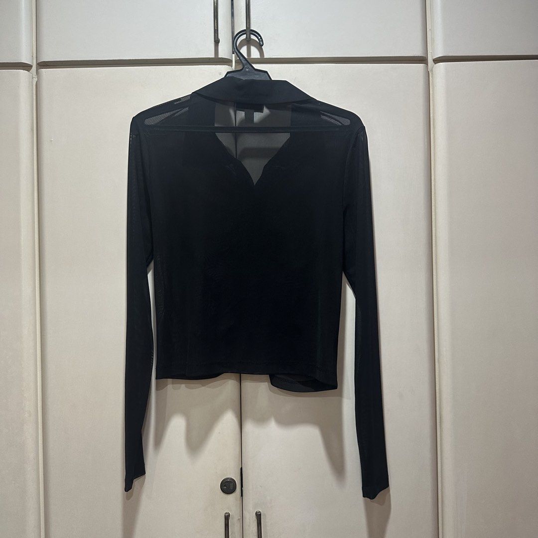 Topshop - Sheet Mesh Ruched Long Sleeve Blouse (Category: Longsleeves) located in Muntinlupa City. Submitted by pickjes (Listing ID 1469718268, Image 2). Description: Brand: Topshop Size: Small Material: 96% polyester, 4% elastane Condition: Brand new, never worn, just stored. No flaws. Rfs: Decluttering, impulse buy Topshop black sheer mesh ruched long-sleeve button-up shirt. It features a classic spread collar, a button placket down the front, 