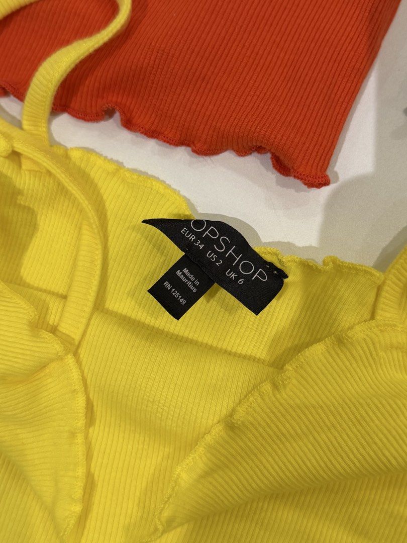 Topshop Ribbed Lettuce Trim Cami Set Bundle (Category: Sleeveless) located in Muntinlupa City. Submitted by henlo03 (Listing ID 1469613390, Image 2). Description: PHP600 for all 3 PHP250 each Bundle of three Topshop cami tops in red, blue, and yellow. Ribbed cotton material with cute lettuce trim edges on the neckline and hem. Super stretchy and comfortable. Yellow and red are EUR 34 / US 2 / UK 6. Blue is EUR 36 / US 4 / UK 8. Great vibrant colo