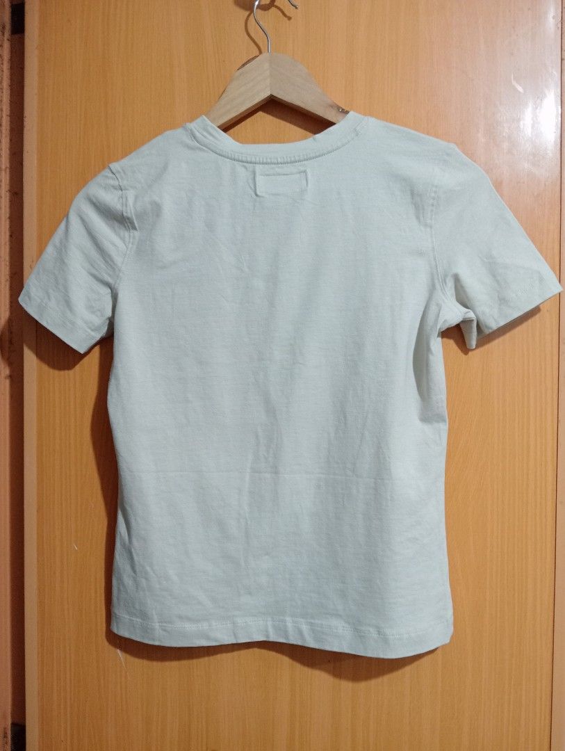 TopTen Good Vibes Graphic Tee (Category: Tshirts & Polo Shirts ) located in Quezon City. Submitted by niceoutfits (Listing ID 1469715018, Image 3). Description: - Brand: Original branding with retail tags still attached - Condition: Brand new, never worn - Design: Fun 'Good Vibes' graphic with cute cartoon bunnies and heart motifs - Color: Grey - Fit: Crew neck, casual everyday fit - Material: Lightweight cotton for all-day comfort.
