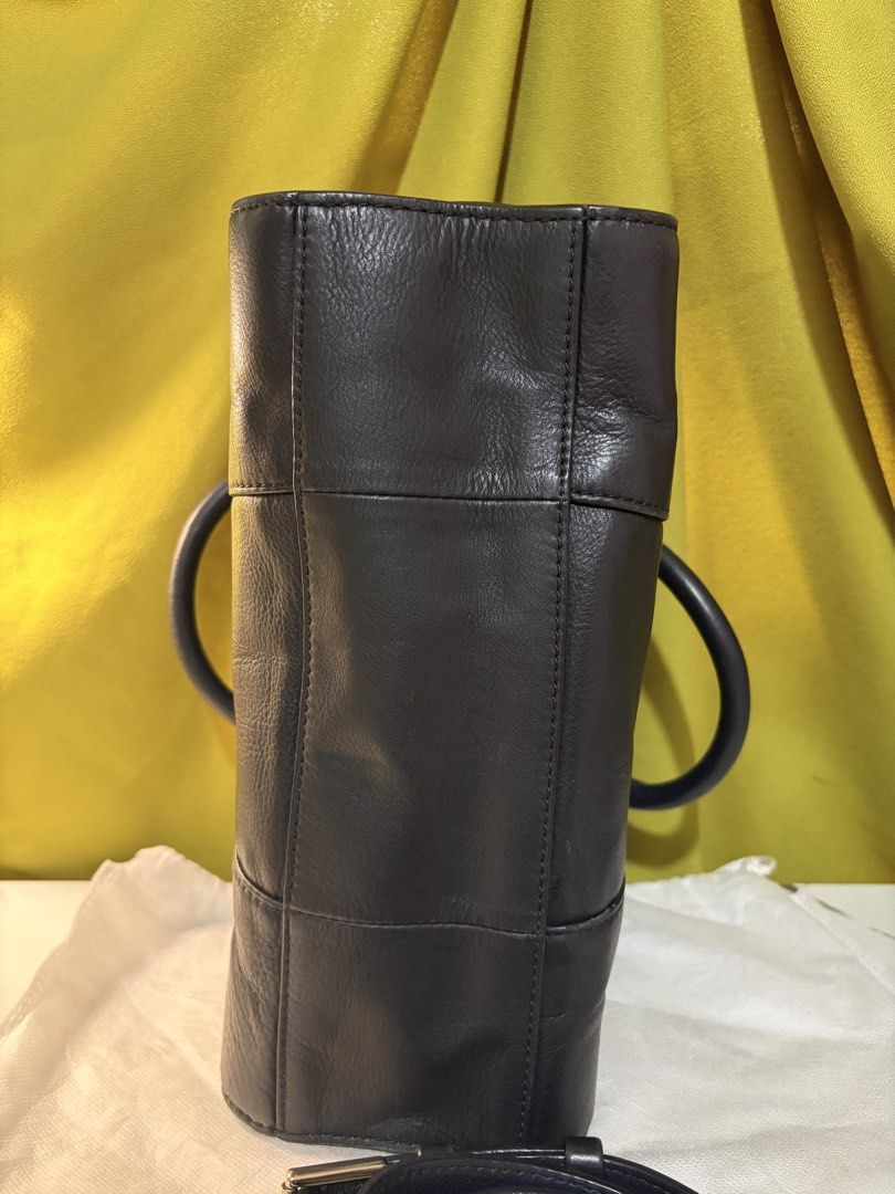 Tory Burch Mini Robinson (Category: Tote Bags) located in Borongan. Submitted by charmspreloveddd (Listing ID 1469596298, Image 3). Description: - Authentic Tory Burch black pebbled leather tote bag - Elegant gold-tone hardware throughout - Dual top handles plus a detachable shoulder strap with chic chain links - Organized interior with a secure center zip compartment and side slip pockets - Features signature logo-printed fabric lining.