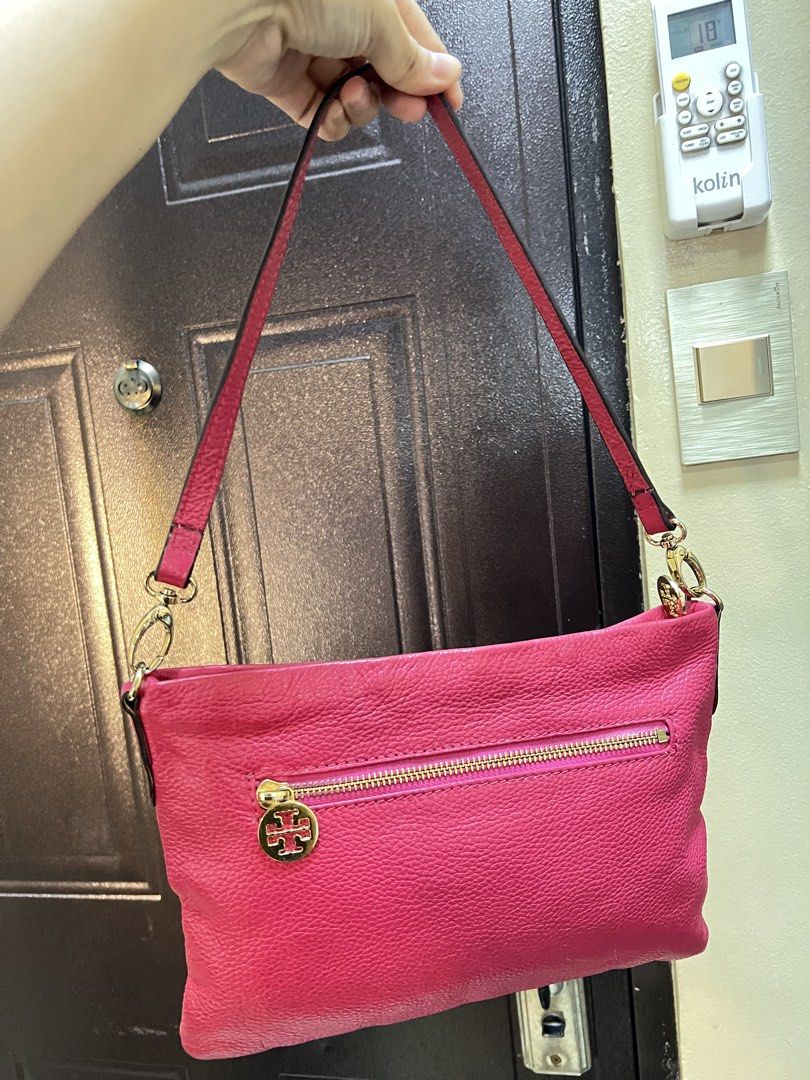 Tory Burch Pink Kili Bag (Category: Luxury Bags & Wallets) located in Manila. Submitted by colineb (Listing ID 1469669269, Image 3). Description: - Brand: Tory Burch - Color: Vibrant pink with polished gold hardware - Exterior: Large front logo emblem and convenient back zip pocket - Interior: Patterned fabric lining with a pink leather brand tag and zip pocket - Strap: Shoulder strap secured with polished gold clasps - Condition: Clean overall c