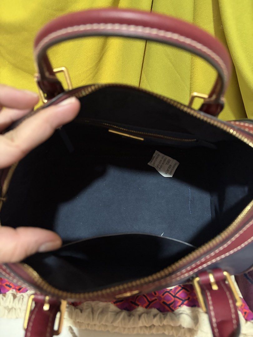 Tory Burch T Monogram Color-Block Barrel Duffle (Category: Luxury Bags & Wallets) located in Borongan. Submitted by charmspreloveddd (Listing ID 1469636844, Image 3). Description: Tory Burch T Monogram Color-Block Barrel Duffle / Mini Boston Bag - Gold tone hardware and logo medallion upfront. - Double top handles plus an adjustable fabric shoulder strap included. - Zip top closure. Clean interior lining with slip and zip pockets. - Dust bag incl