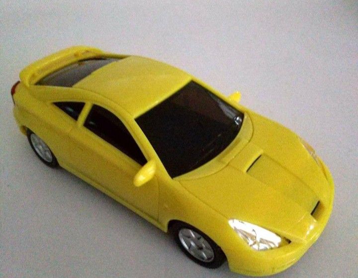Toyco Yellow Toy Car Model (Category: Vehicle & Diecast Models) located in Tarlac. Submitted by kaizer_shaunne (Listing ID 1469618764, Image 1). Description: - Brand: Toyco - Color: Bright yellow - Features: Rear spoiler and black tinted windows - Details: Molded headlights, tail lights, and clear license plate branding - Wheels: Silver hubcaps on all four wheels - Material: Durable solid plastic construction throughout.