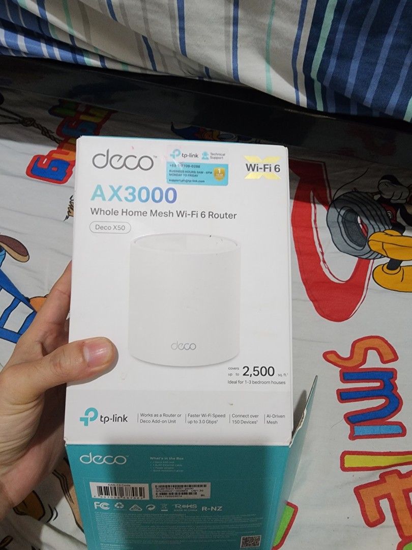 TP-Link Deco X50 AX3000 Wi-Fi 6 Router (Category: Networking) located in Meycauayan. Submitted by MP_Shop (Listing ID 1469622437, Image 2). Description: - Model: TP-Link Deco X50 AX3000 Whole Home Mesh Wi-Fi 6 Router - Coverage: Up to 2,500 square feet of seamless Wi-Fi - Capacity: Supports up to 150 connected devices simultaneously - Design: Modern, sleek white cylindrical unit - Inclusions: Original box, power adapter, RJ45 Ethernet cable, and 