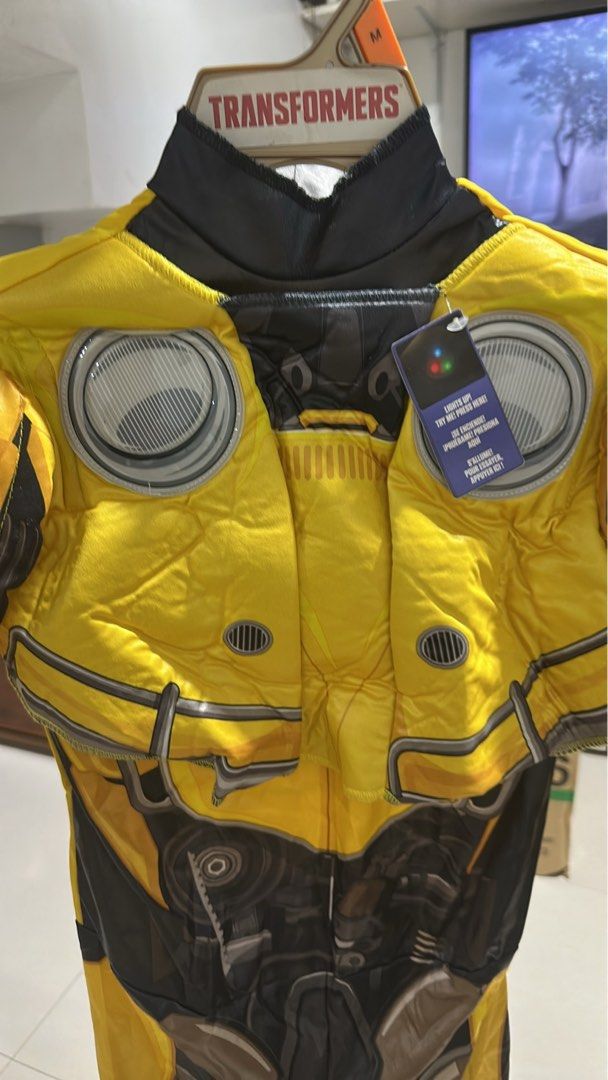 Transformers Bumblebee Costume Size M 8-10 (Category: Babies & Kids Fashion) located in Quezon City. Submitted by breakstuf50 (Listing ID 1469733102, Image 3). Description: - Transformers Bumblebee costume for kids - Size: Medium (8-10) - Features a light-up chest with an active try-me button - Detailed mechanical robot prints on front and back - Padded chest pieces for an authentic armor look - Perfect for parties, Halloween, and dress-up fun.
