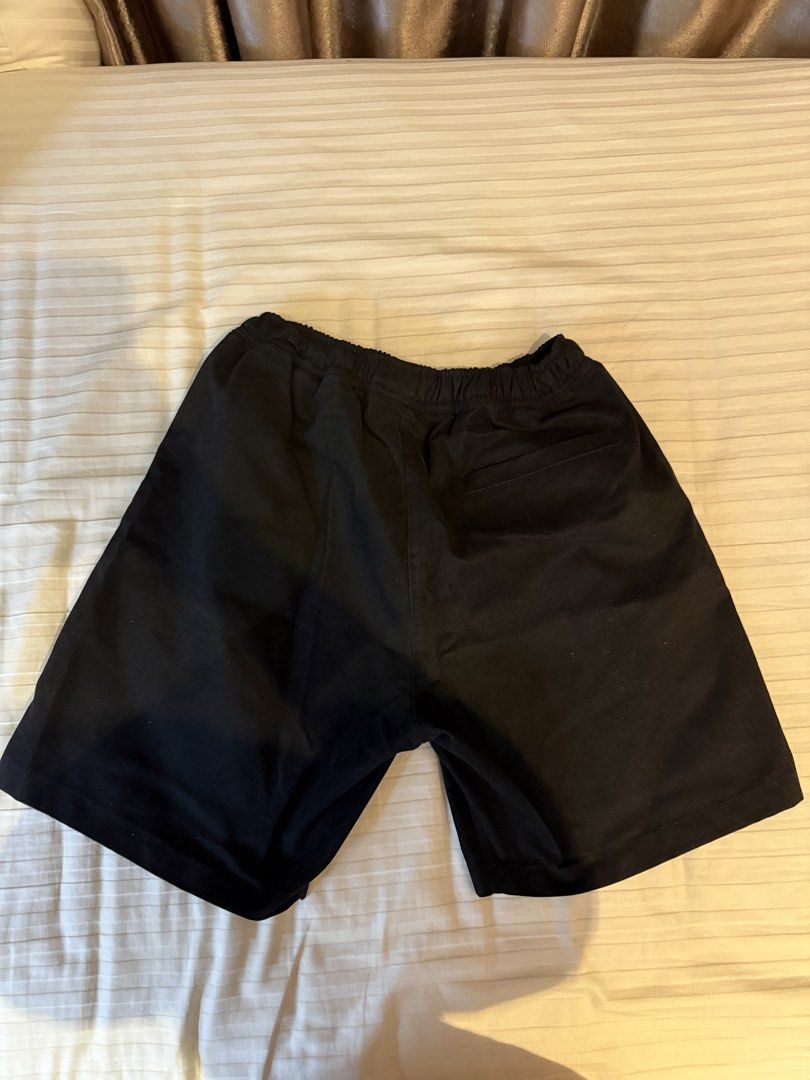 Tropically Made Black Shorts Size S 30-32 (Category: Shorts) located in Muntinlupa City. Submitted by golf823 (Listing ID 1469683615, Image 3). Description: - Brand: Tropically Made - Color: Black - Size: S (Fits waist 30-32) - Waistband: Elastic with maroon drawstring closure - Pockets: Two front pockets and one back pocket - Details: Subtle logo embroidered on the lower left leg - Condition: Clean fabric, solid stitching throughout - Origin: Ma
