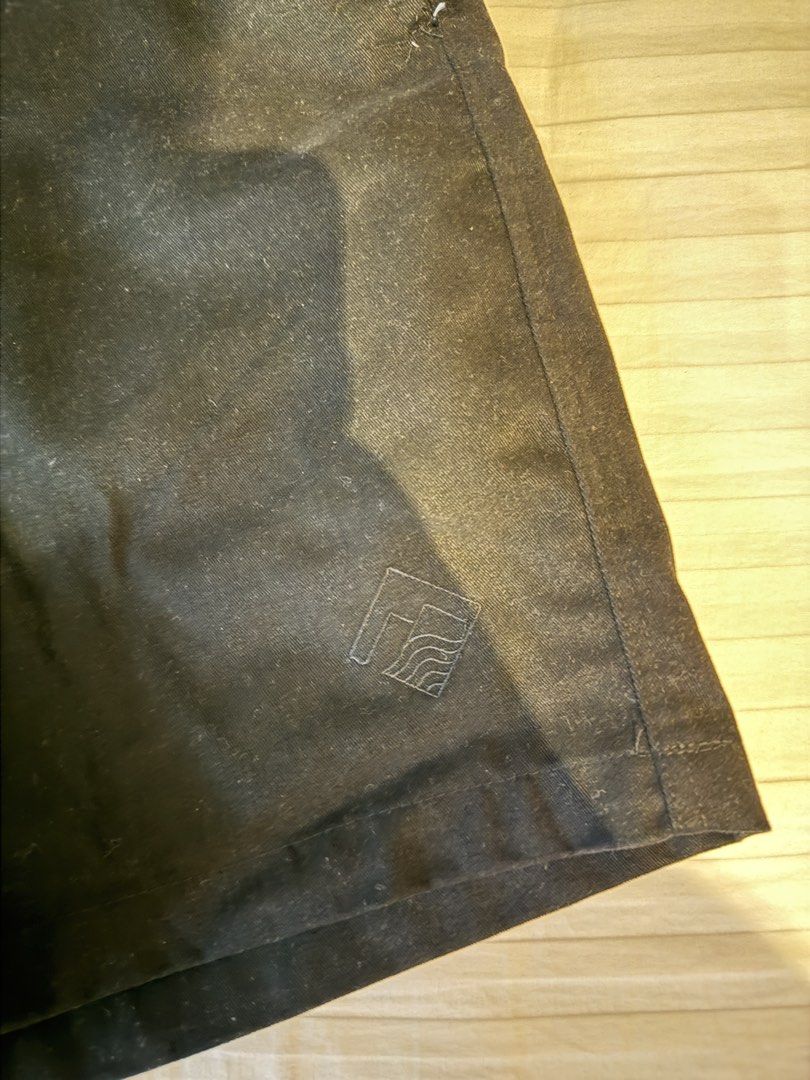 Tropically Made Black Shorts Size S 30-32 (Category: Shorts) located in Muntinlupa City. Submitted by golf823 (Listing ID 1469683615, Image 2). Description: - Brand: Tropically Made - Color: Black - Size: S (Fits waist 30-32) - Waistband: Elastic with maroon drawstring closure - Pockets: Two front pockets and one back pocket - Details: Subtle logo embroidered on the lower left leg - Condition: Clean fabric, solid stitching throughout - Origin: Ma