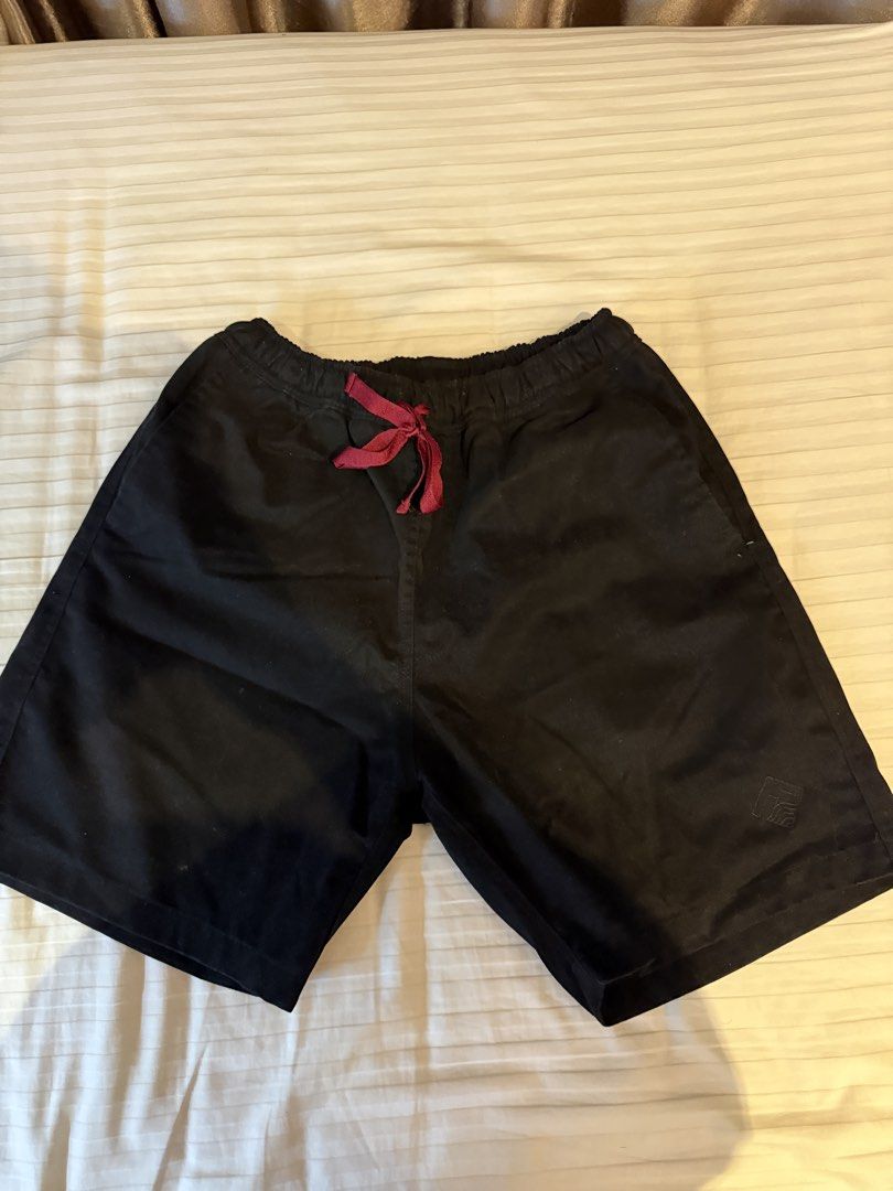 Tropically Made Black Shorts Size S 30-32 (Category: Shorts) located in Muntinlupa City. Submitted by golf823 (Listing ID 1469683615, Image 1). Description: - Brand: Tropically Made - Color: Black - Size: S (Fits waist 30-32) - Waistband: Elastic with maroon drawstring closure - Pockets: Two front pockets and one back pocket - Details: Subtle logo embroidered on the lower left leg - Condition: Clean fabric, solid stitching throughout - Origin: Ma