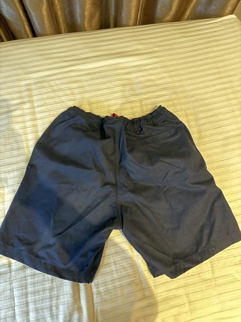 Tropically Made Navy Shorts Size S 30-32 (Category: Shorts) located in Muntinlupa City. Submitted by golf823 (Listing ID 1469683907, Image 2). Description: - Brand: Tropically Made - Size: S (fits waist 30-32) - Color: Navy blue with a dark red drawstring - Pockets: Two side pockets and one back pocket - Details: Elastic waistband, clean stitching, smooth fabric - Origin: Made in the Philippines - Condition: Great for casual wear.