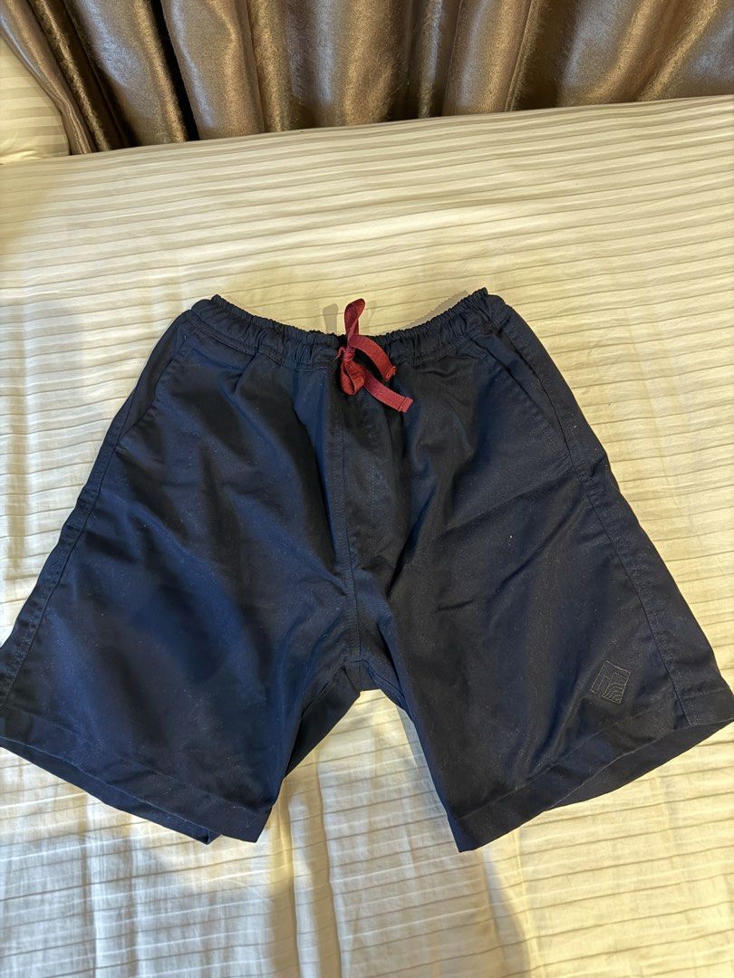 Tropically Made Navy Shorts Size S 30-32 (Category: Shorts) located in Muntinlupa City. Submitted by golf823 (Listing ID 1469683907, Image 1). Description: - Brand: Tropically Made - Size: S (fits waist 30-32) - Color: Navy blue with a dark red drawstring - Pockets: Two side pockets and one back pocket - Details: Elastic waistband, clean stitching, smooth fabric - Origin: Made in the Philippines - Condition: Great for casual wear.