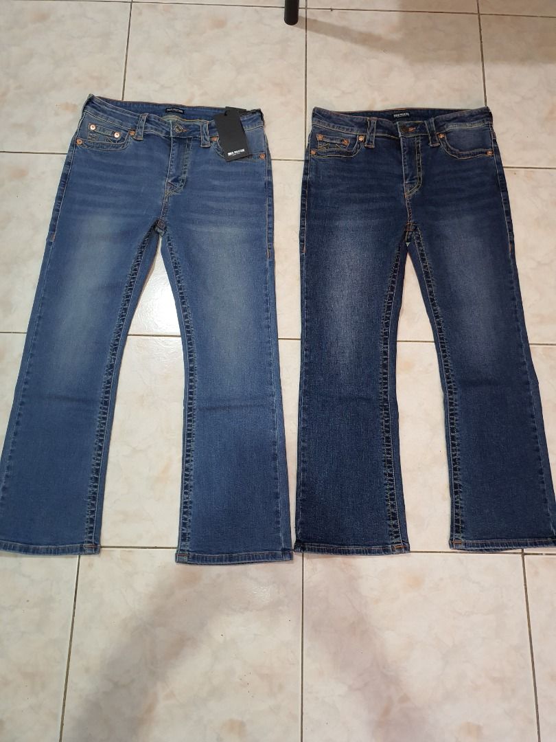 True religion boot cut jeans (Category: Jeans) located in Caloocan City. Submitted by cleverwind_1e53ab (Listing ID 1469637996, Image 3). Description: - Brand: True Religion - Style: Boot cut jeans - Colors: Light blue and dark blue wash - Size: 30 (Waist: 76cm, Hips: 97cm) - Material: 98% Cotton, 2% Polyurethane for slight stretch - Condition: Brand new with tags (BNWT) - Origin: Made in Vietnam - Features: Classic back pocket stitching and bran